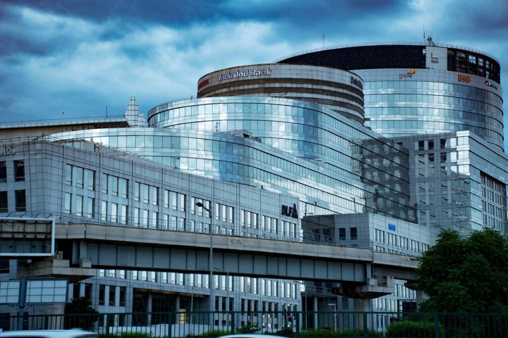 Sleek modern glass bank building exterior with reflective architecture