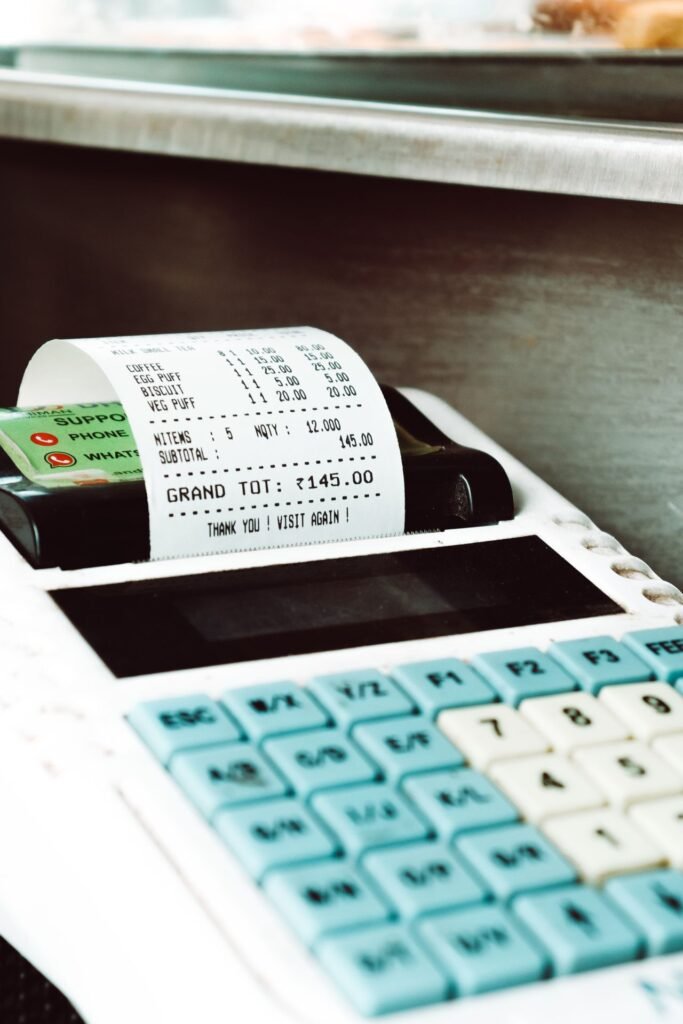 Cash register till printing a sales receipt in a retail store