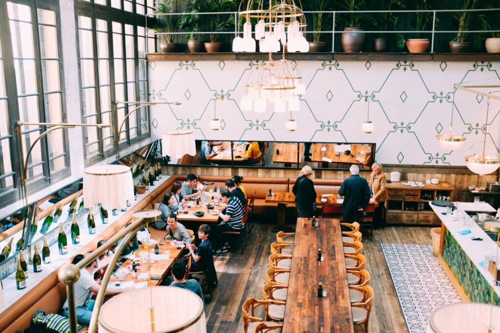 Restaurant interior with wooden tables and diners enjoying their meals