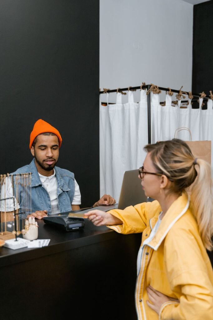 Customer paying by card at a retail store checkout counter